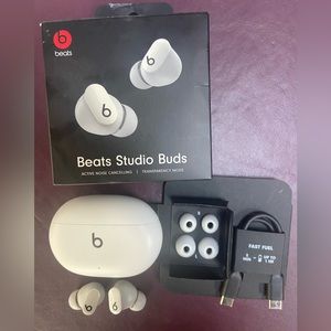 Gently used white Beats Studio Buds.